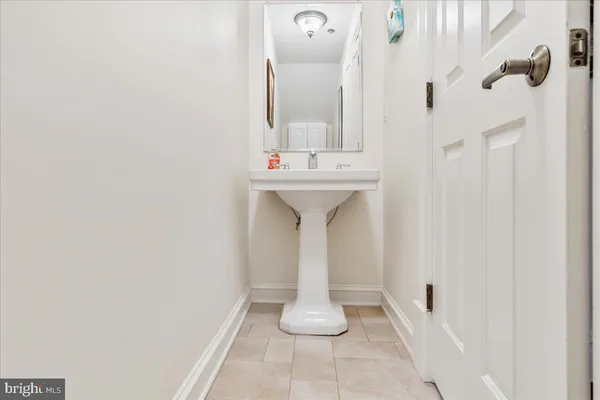 a bathroom with a sink and mirror