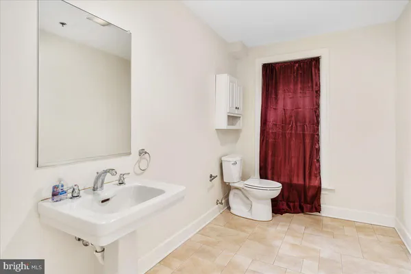 a bathroom with a sink and a toilet