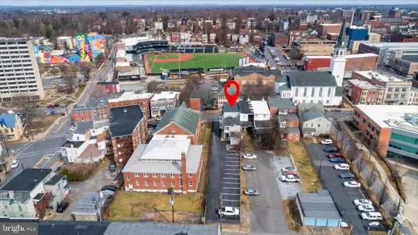an aerial view of residential building and parking space