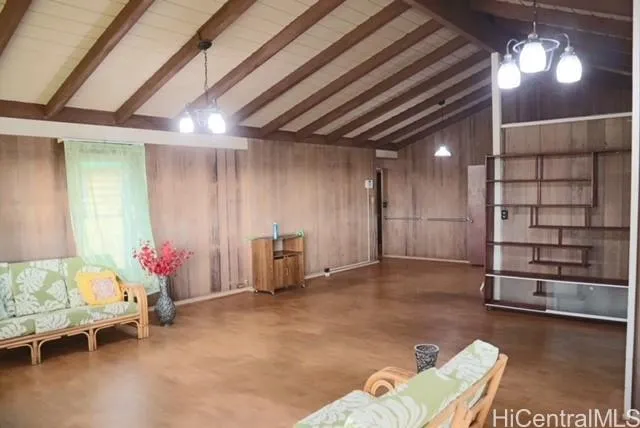 a living room with furniture and flowers