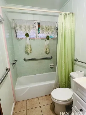a bathroom with a shower and toilet