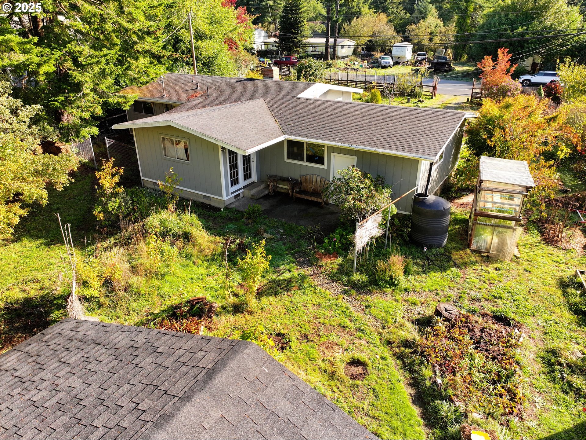 2537 Port Orford Loop Road Port Orford, OR 97465 - Photo 13 of 32 a aerial view of a house with a yard