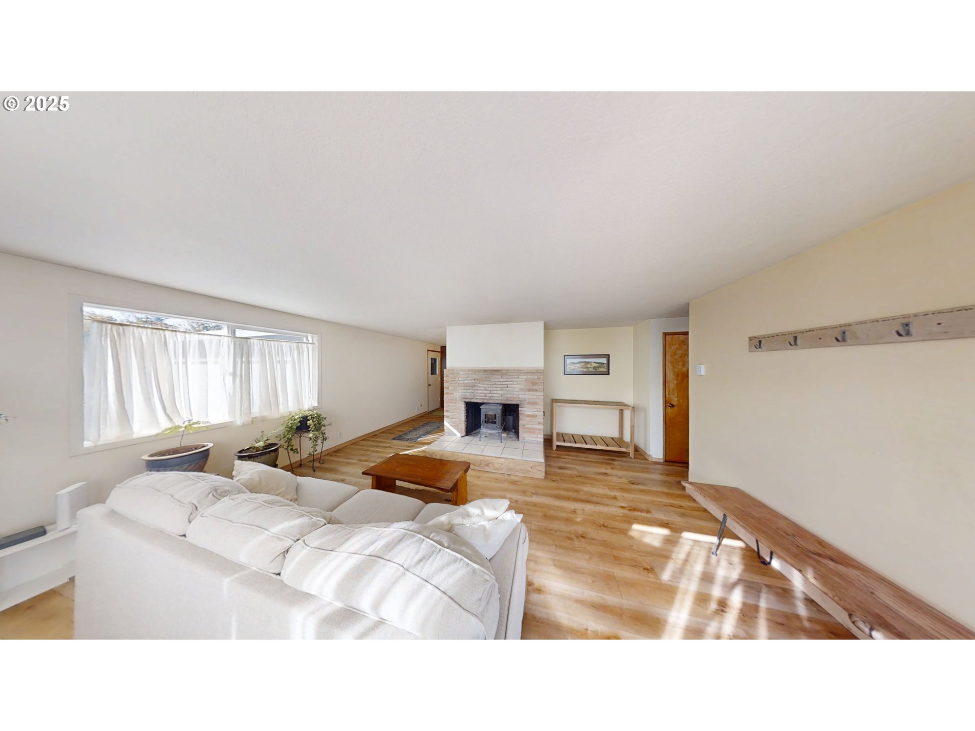 2537 Port Orford Loop Road Port Orford, OR 97465 - Photo 18 of 32 a bedroom with a bed and window