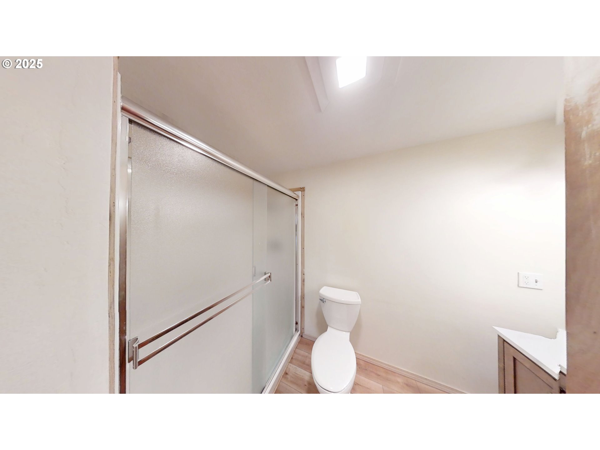 2537 Port Orford Loop Road Port Orford, OR 97465 - Photo 20 of 32 a bathroom with a toilet a sink and a mirror