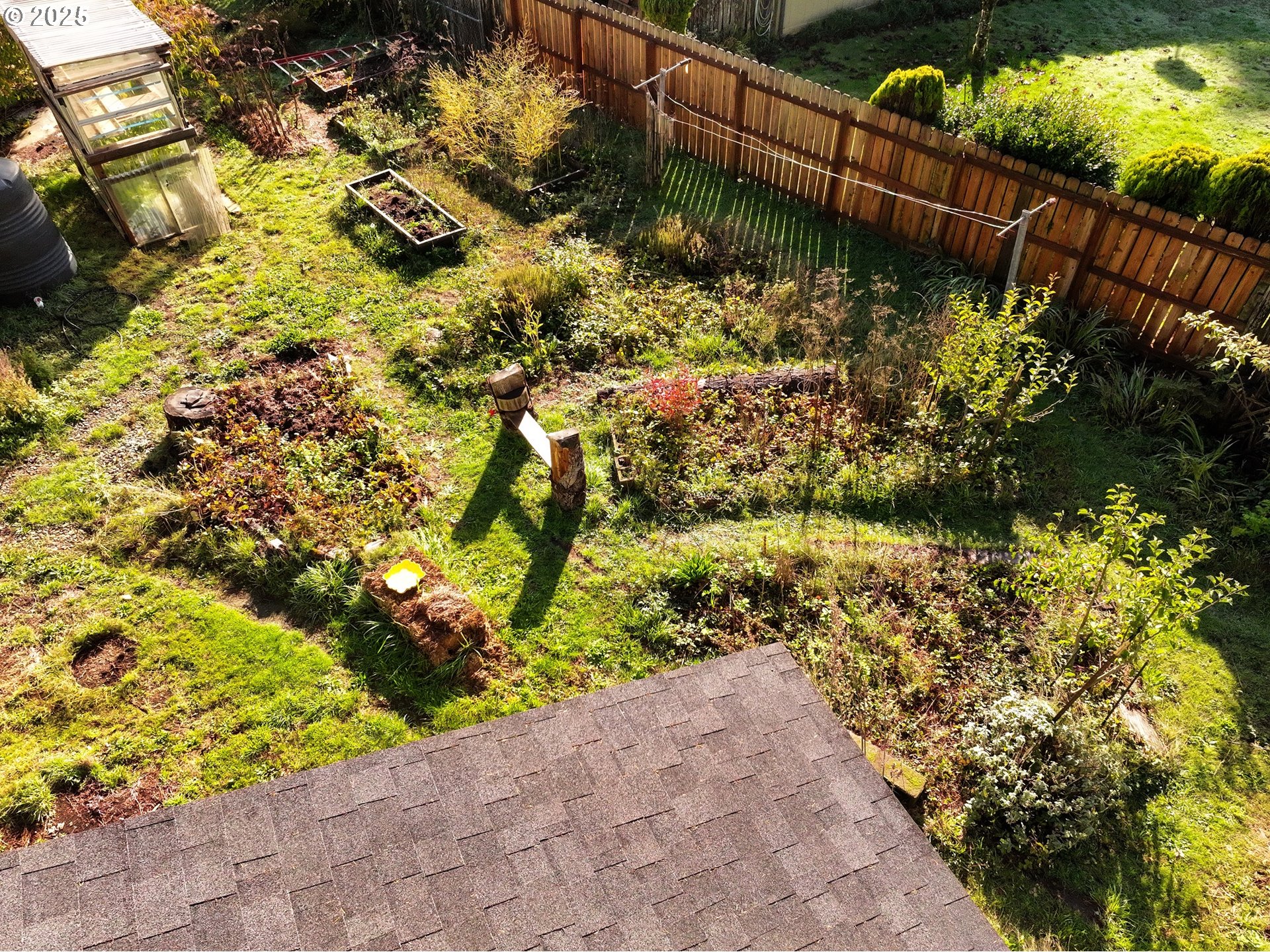2537 Port Orford Loop Road Port Orford, OR 97465 - Photo 7 of 32 a view of a garden with wooden fence
