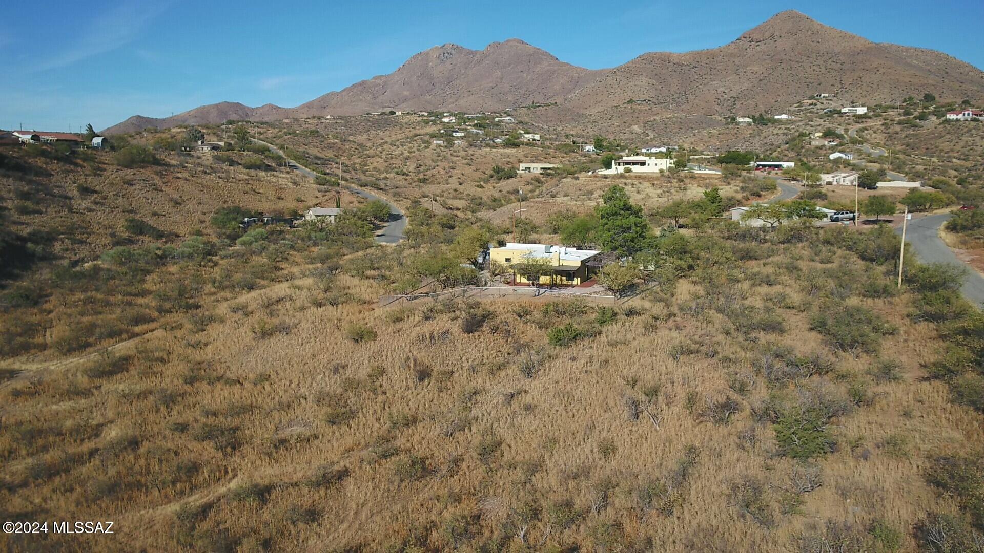 1312 Avenida Gutierrez Rio Rico, AZ 85648 - Photo 43 of 46 a view of a mountain in the distance in a field