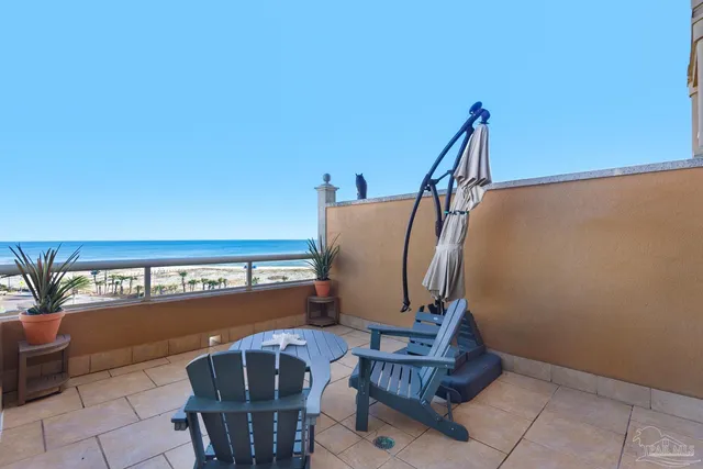 a view of balcony with furniture