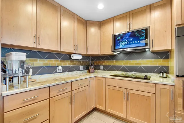 a kitchen with cabinets and window