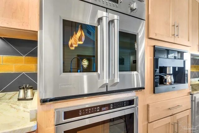 a kitchen with a stove and a microwave