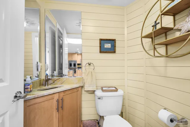 a bathroom with a sink mirror toilet and shower