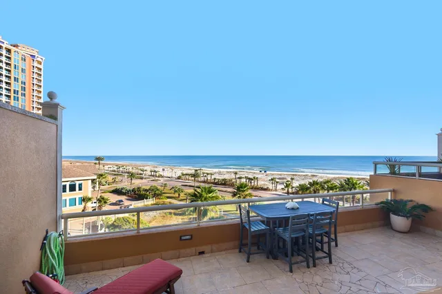 a view of a chairs and table in a terrace