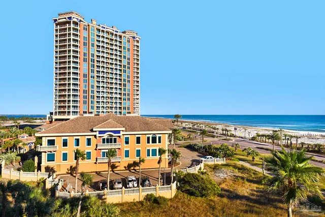 a front view of a building with outdoor space and sitting space