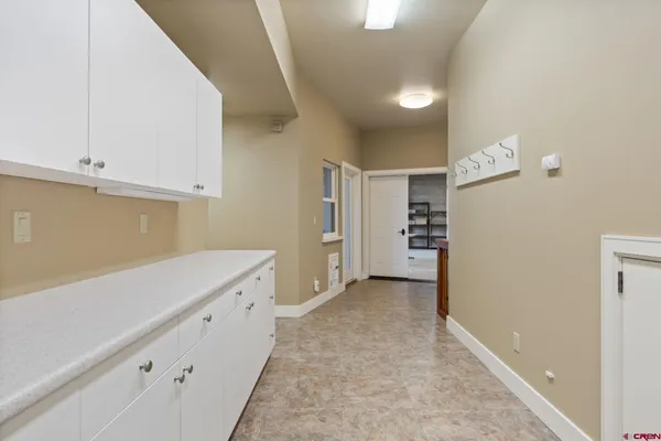 a view of an empty room with closet