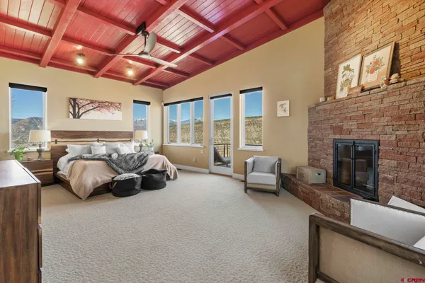 a bedroom with furniture and a fireplace