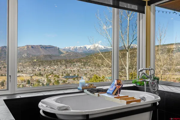 a room with wooden floor and a window