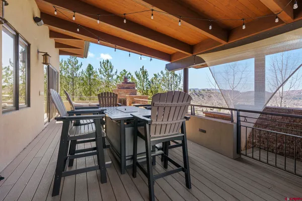 a view of a patio with table and chairs
