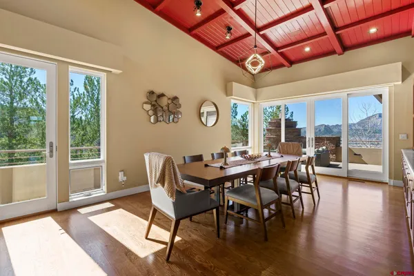 a view of a dining room with furniture window and wooden floor