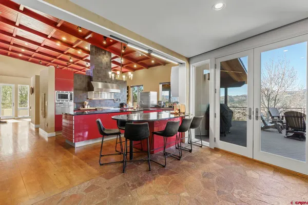 a view of a dining room with furniture window and outside view