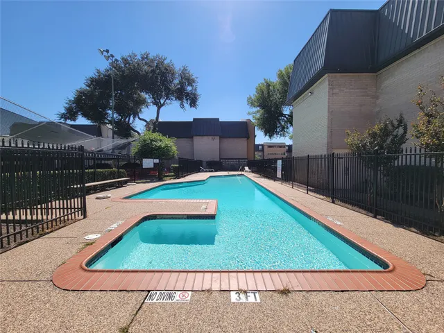 a view of a backyard with a small pool