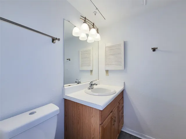 a bathroom with a sink a vanity and a mirror