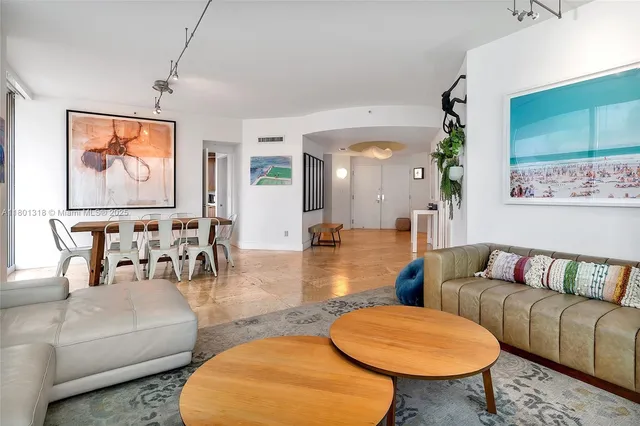 a living room with furniture and a rug