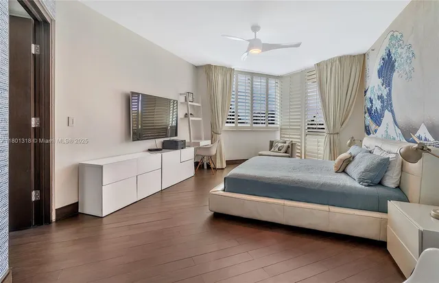 a spacious bedroom with a bed and a couch