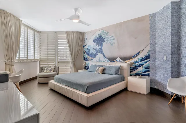 a bedroom with a bed and a chair