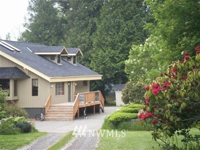 a front view of a house with a yard patio and fire pit