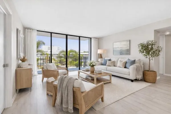 a living room with furniture and a large window