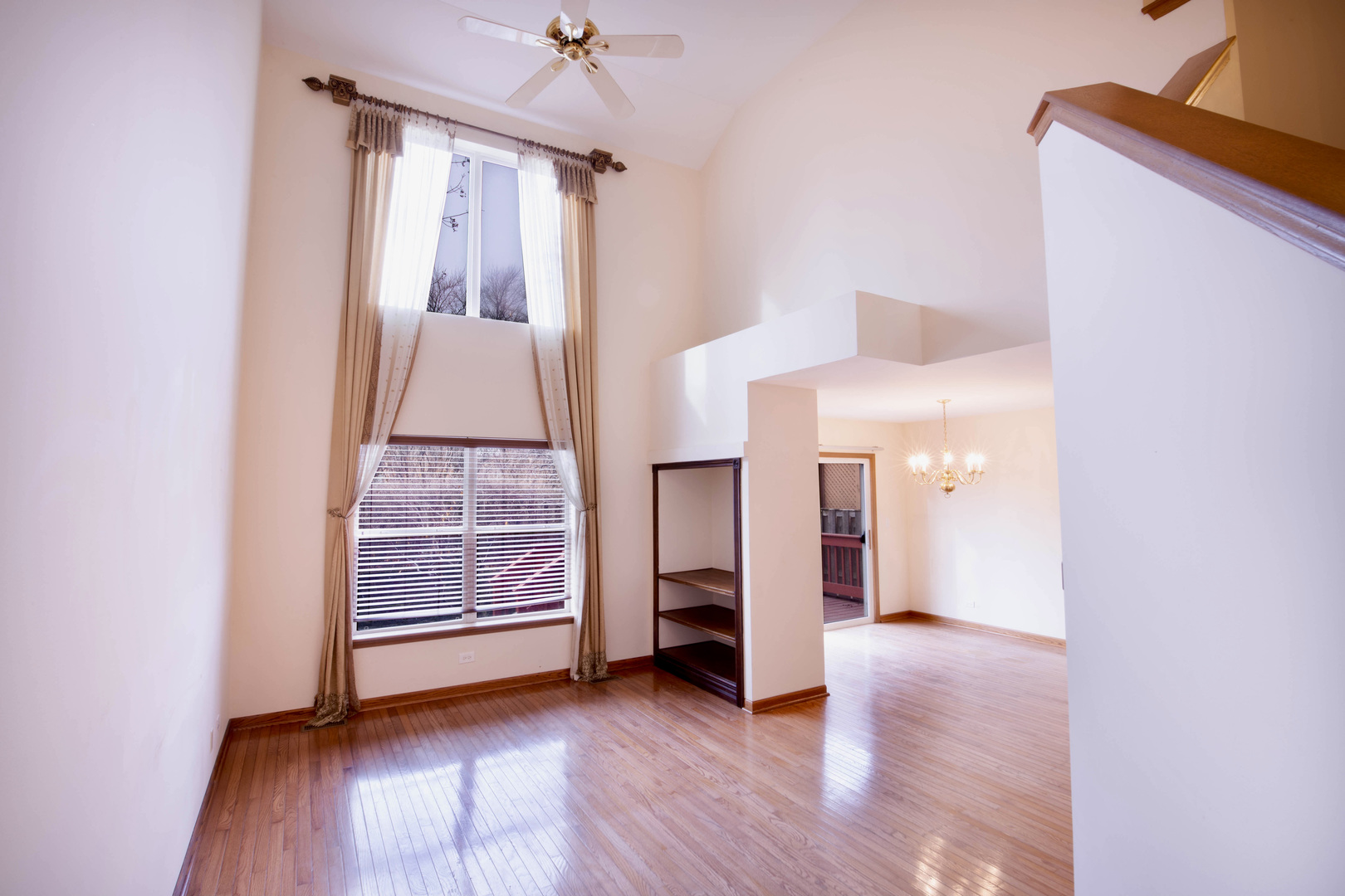 4736 Lacey Avenue Lisle, IL 60532 - Photo 2 of 20 a view of an empty room with window and wooden floor