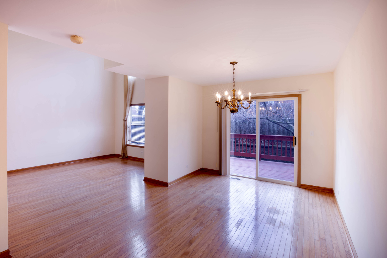 4736 Lacey Avenue Lisle, IL 60532 - Photo 6 of 20 a view of a room with wooden floor chandelier and window