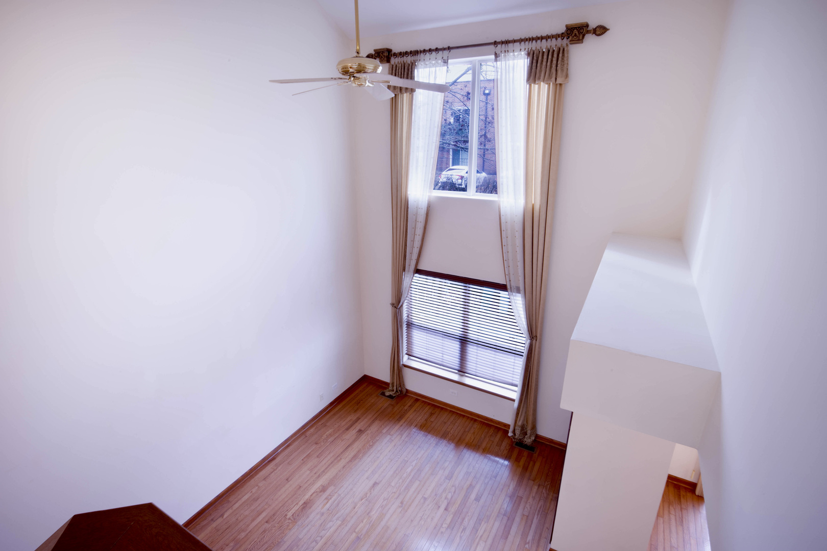 4736 Lacey Avenue Lisle, IL 60532 - Photo 9 of 20 a view of empty room with wooden floor and fan