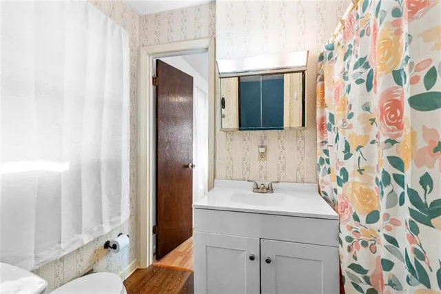 a bathroom with a sink and toilet