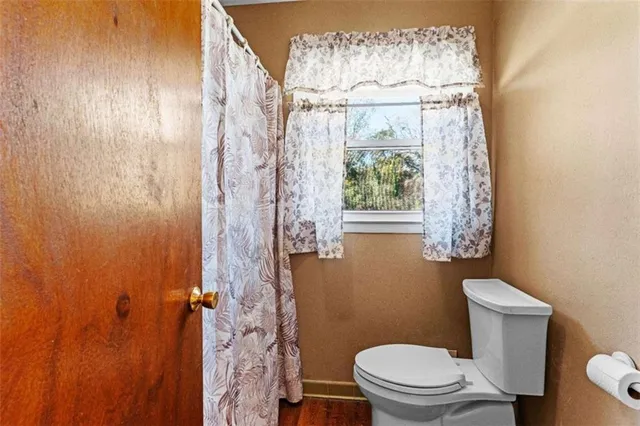 a view of wooden deck and a backyard