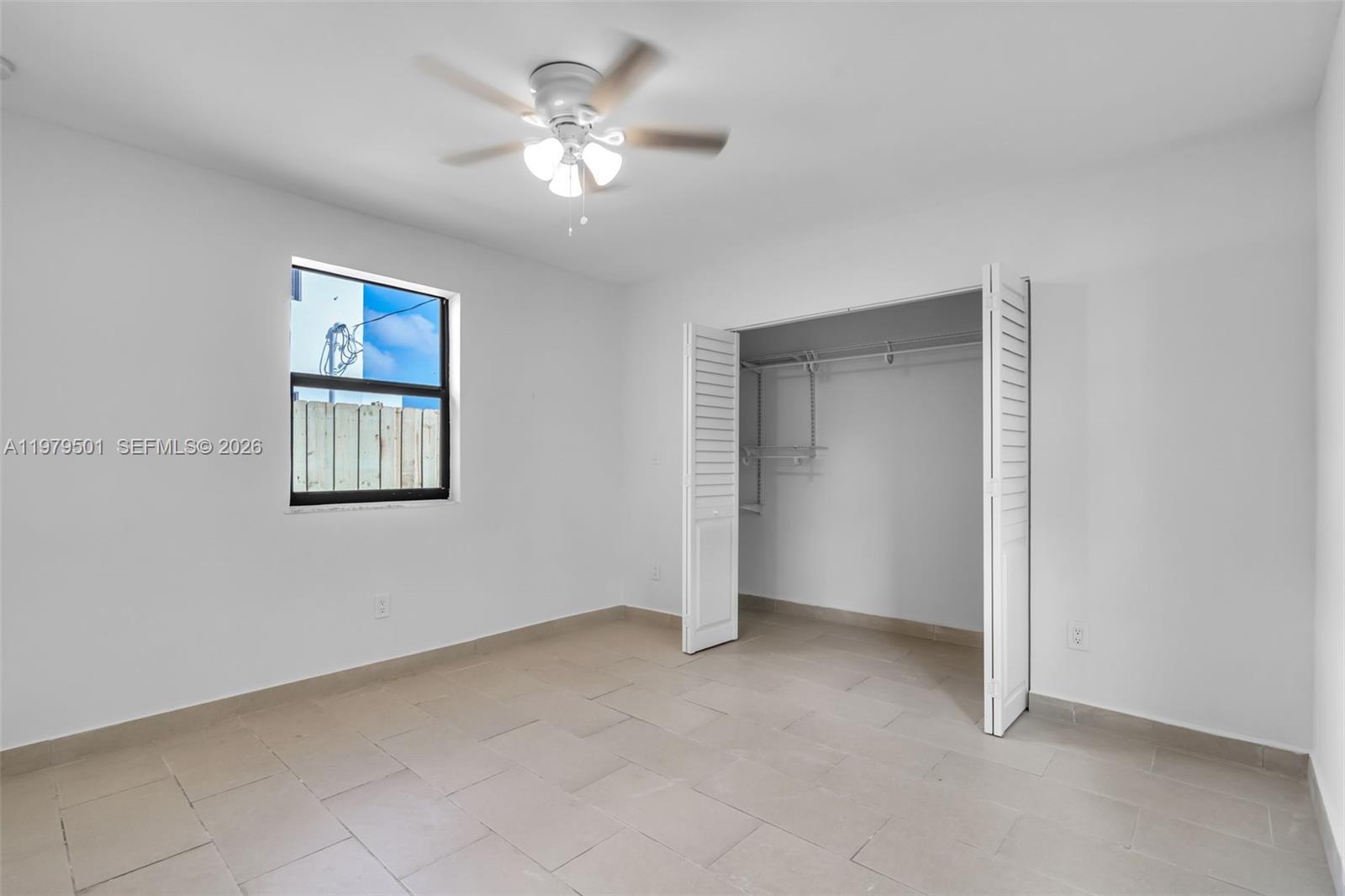 130 Southwest 31st Court, Unit 2 Miami, FL 33135 - Photo 11 of 14 a view of an empty room with a window