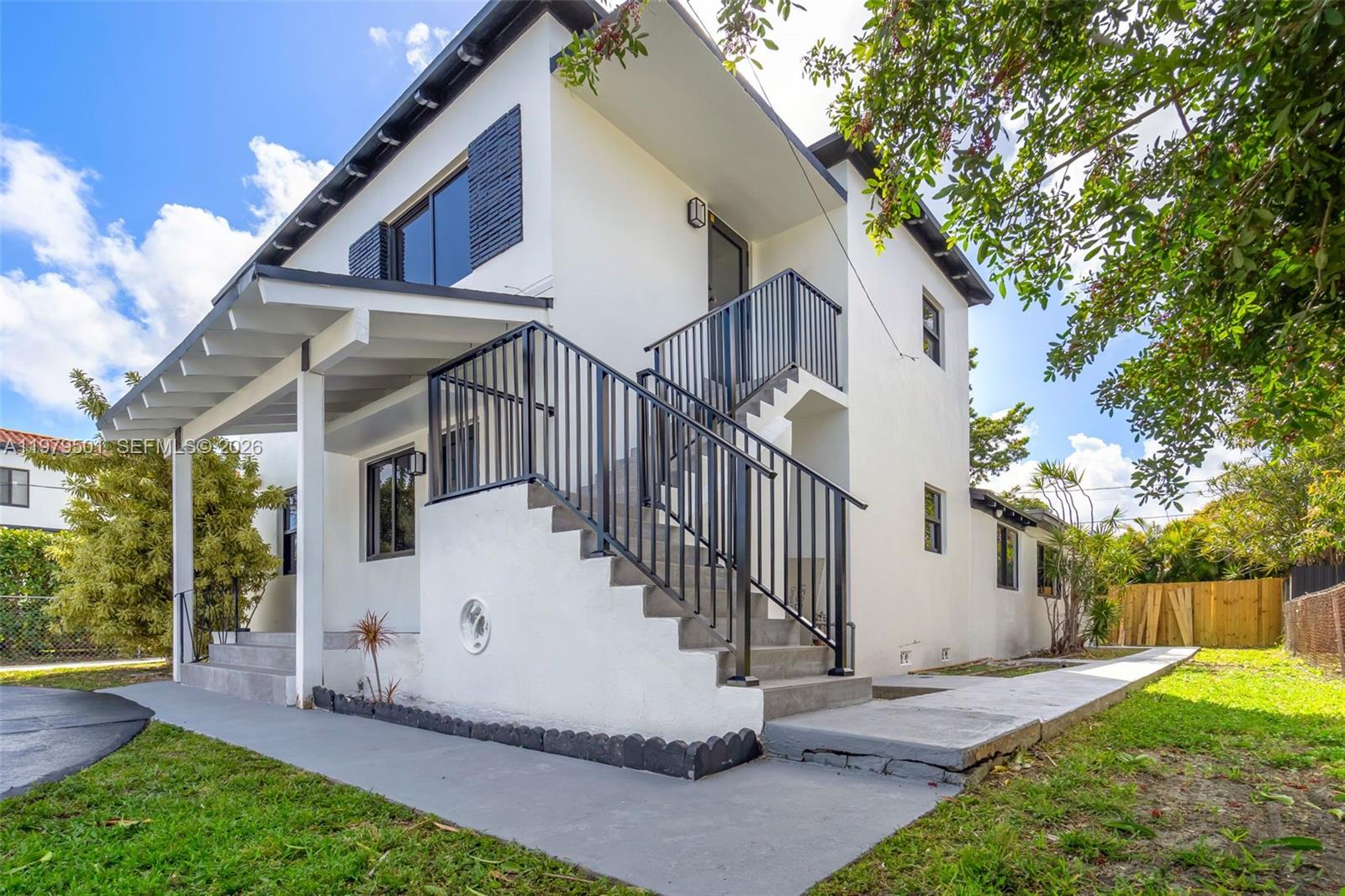 130 Southwest 31st Court, Unit 2 Miami, FL 33135 - Photo 2 of 14 a view of house with backyard and glass windows