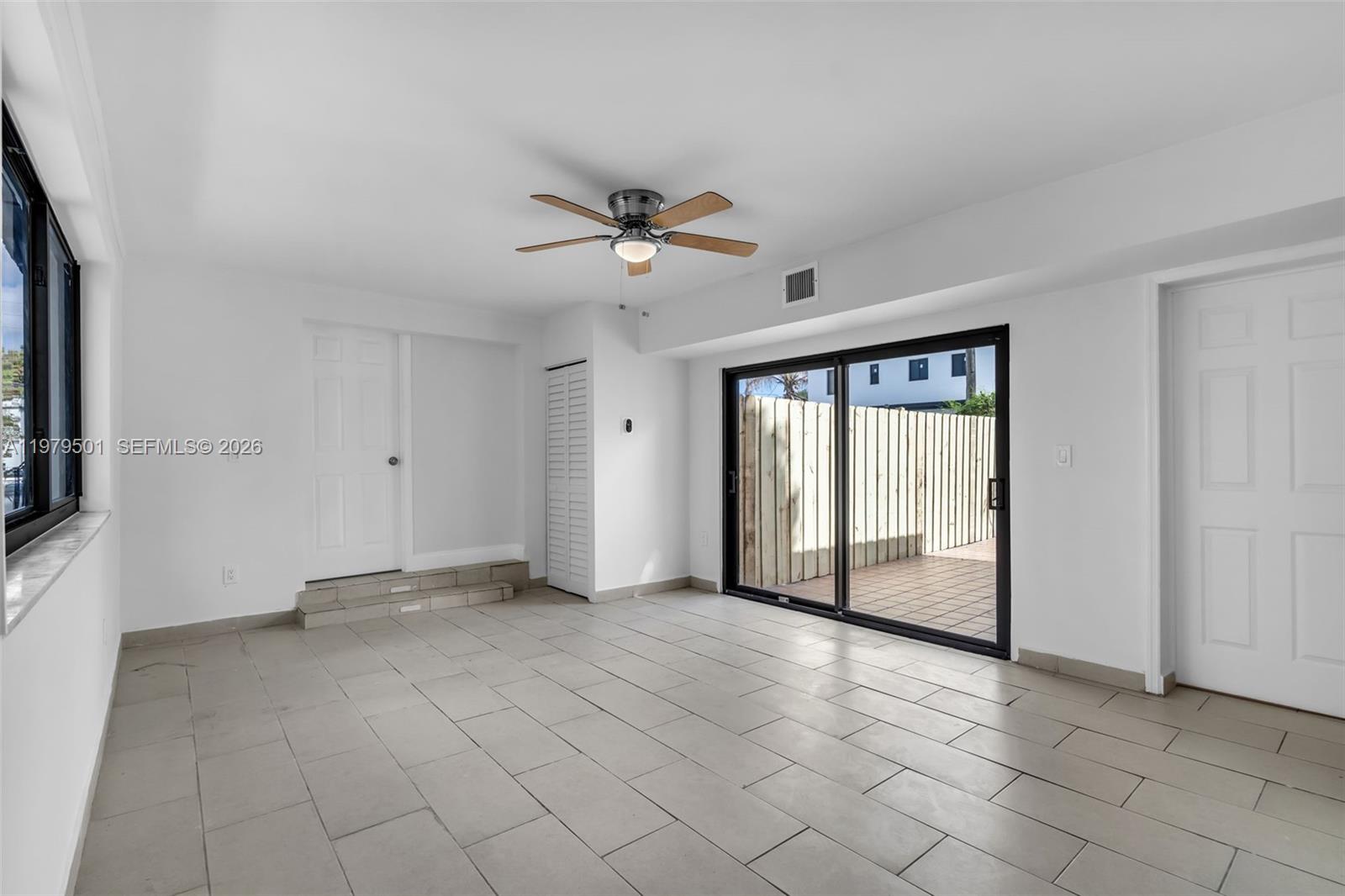 130 Southwest 31st Court, Unit 2 Miami, FL 33135 - Photo 4 of 14 a view of an empty room with a window