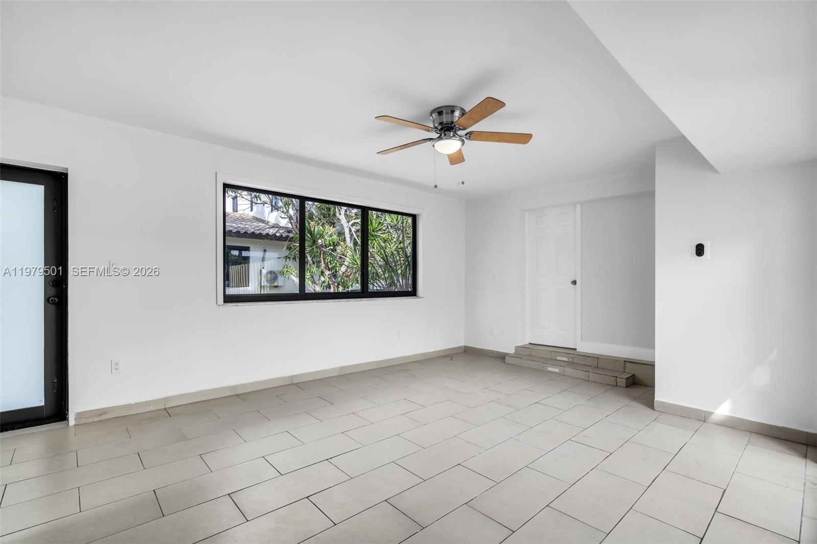 130 Southwest 31st Court, Unit 2 Miami, FL 33135 - Photo 6 of 14 a view of an empty room with a window