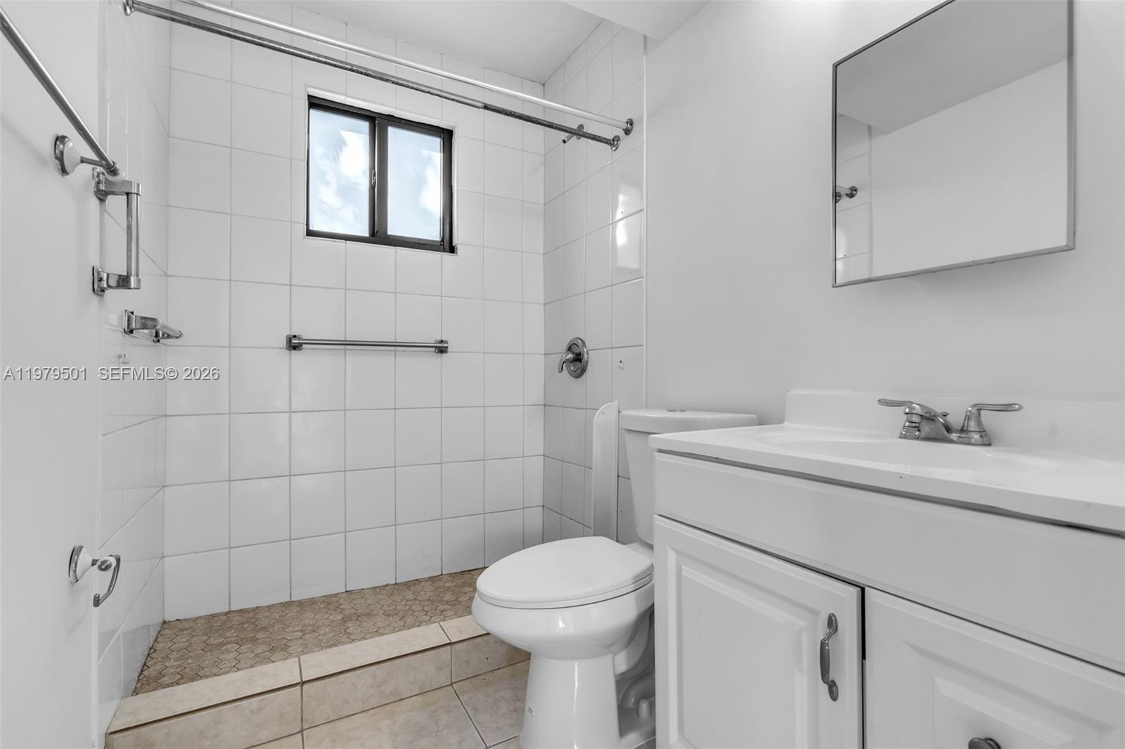 130 Southwest 31st Court, Unit 2 Miami, FL 33135 - Photo 9 of 14 a bathroom with a sink a toilet and shower