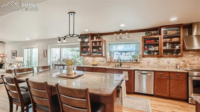 4710 Sandstone Road Monument, CO 80132 - Photo 10 of 28 Solid Granite tops and tile backsplash, huge center island and wood floors