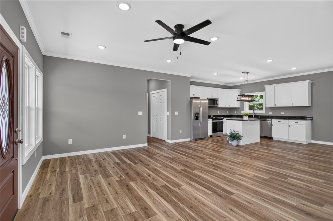 223 Maple Drive Anderson, SC 29621 - Photo 6 of 45 A contemporary open-concept layout unites a stylish kitchen with spacious living areas, creating an inviting flow.