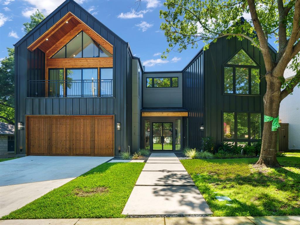 4010 Sperry Street Dallas, TX 75214 - Photo 1 of 40 View of front facade featuring board and batten siding, a garage, concrete driveway, french doors, and a front yard