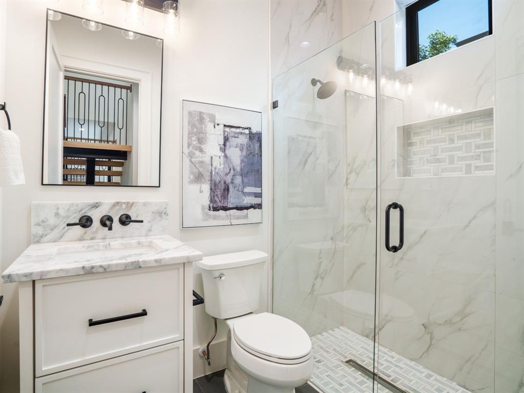 4010 Sperry Street Dallas, TX 75214 - Photo 16 of 40 Bathroom with vanity and a marble finish shower