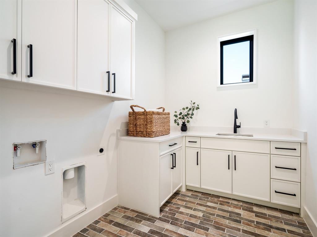 4010 Sperry Street Dallas, TX 75214 - Photo 20 of 40 Laundry area featuring brick floors, cabinet space, electric dryer hookup, and washer hookup
