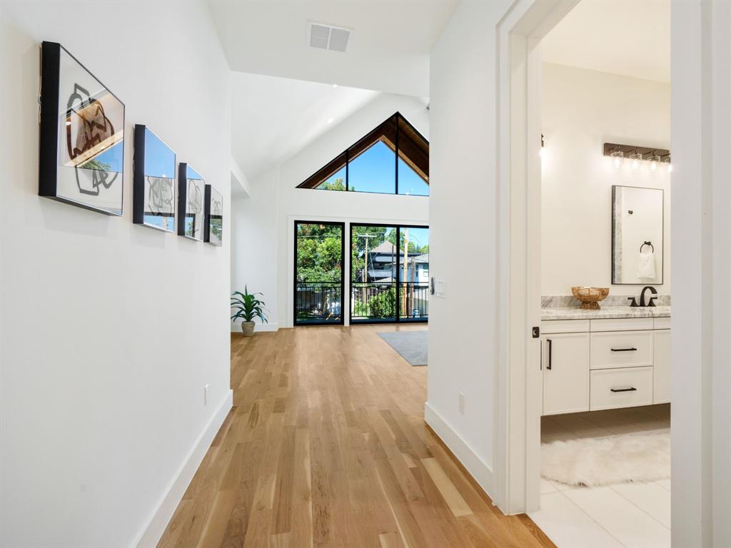 4010 Sperry Street Dallas, TX 75214 - Photo 24 of 40 Hall with lofted ceiling and light wood-type flooring