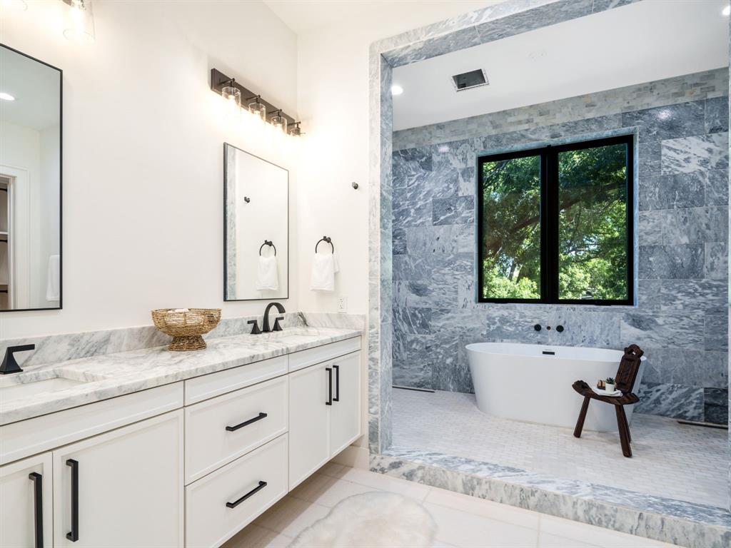 4010 Sperry Street Dallas, TX 75214 - Photo 27 of 40 Bathroom featuring double vanity, tile walls, light tile patterned floors, a soaking tub, and recessed lighting