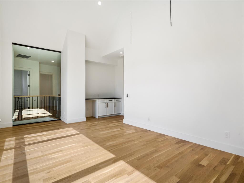 4010 Sperry Street Dallas, TX 75214 - Photo 30 of 40 Spare room featuring light wood-type flooring, a high ceiling, and recessed lighting