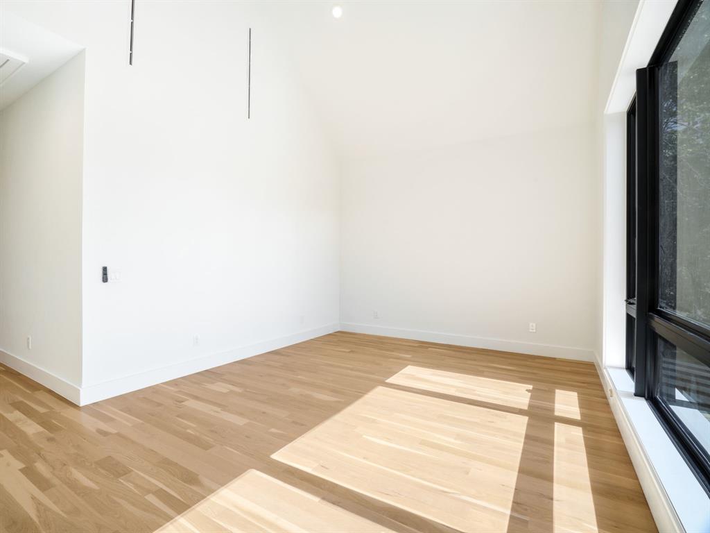 4010 Sperry Street Dallas, TX 75214 - Photo 31 of 40 Spare room featuring light wood finished floors and lofted ceiling
