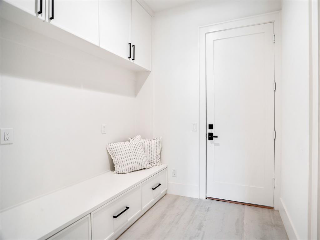4010 Sperry Street Dallas, TX 75214 - Photo 34 of 40 Mudroom featuring light wood-style floors and baseboards