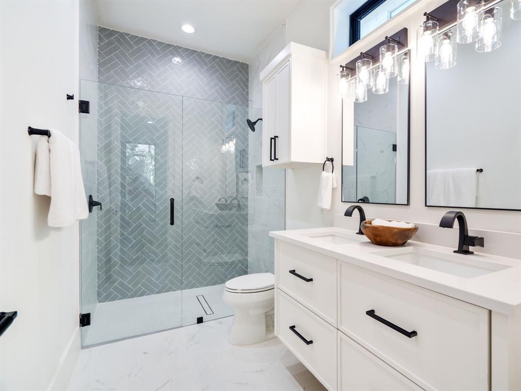 4010 Sperry Street Dallas, TX 75214 - Photo 35 of 40 Bathroom with double vanity, a shower stall, and recessed lighting